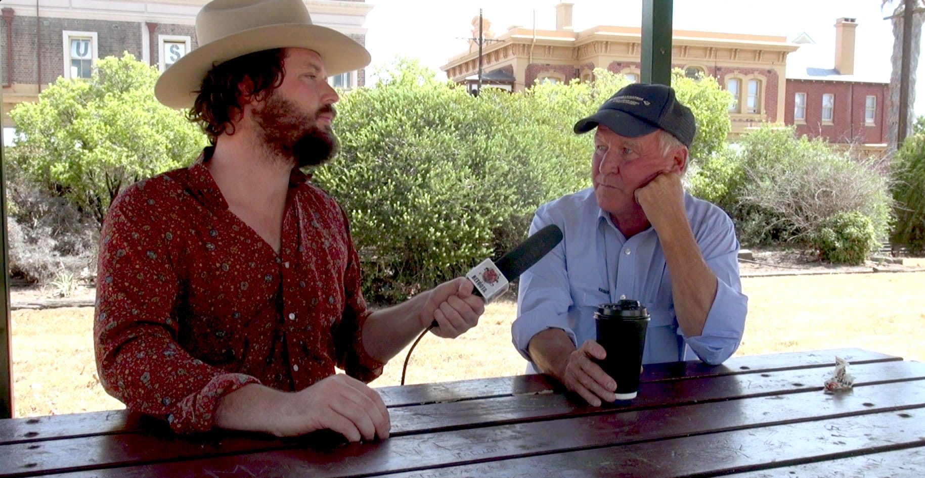 Tony Windsor speaks to Clancy Overell in the main street of Werris Creek