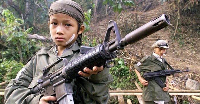 Bryce Wardlaw [left] plays with his dad's Adler A110 on a hunting trip in the Daintree while his younger brother Dugald smokes a cigarette in the background