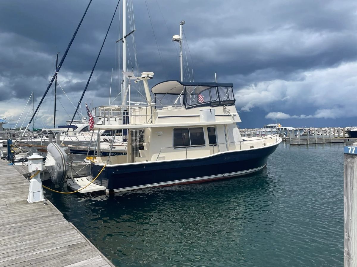 PartnerShip II, a white Mainship 400 trawler, secured at the dock.