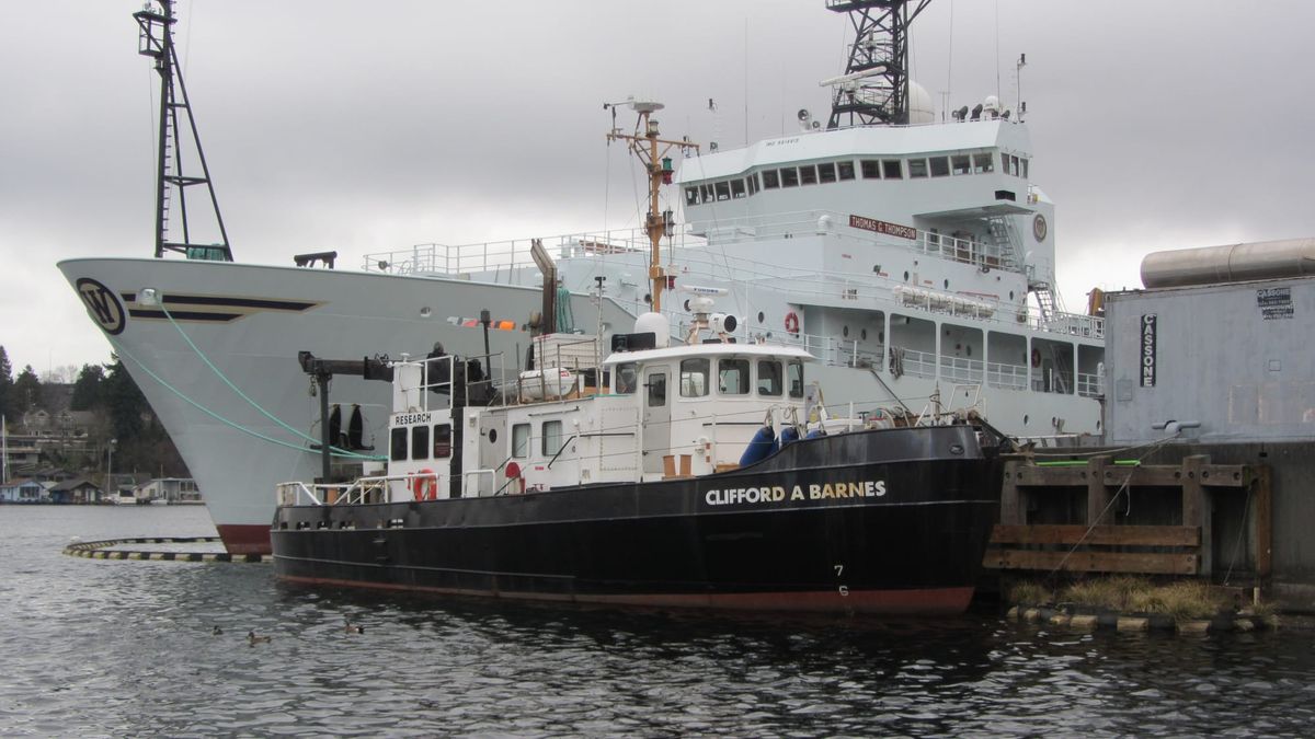 R/V Clifford A. Barnes, the BITT hull during University of Washington research service, moored beside a larger ship.