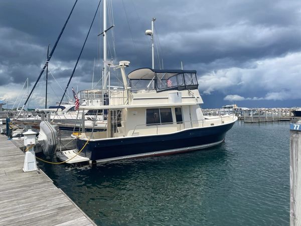 PartnerShip II, a white Mainship 400 trawler, secured at the dock.