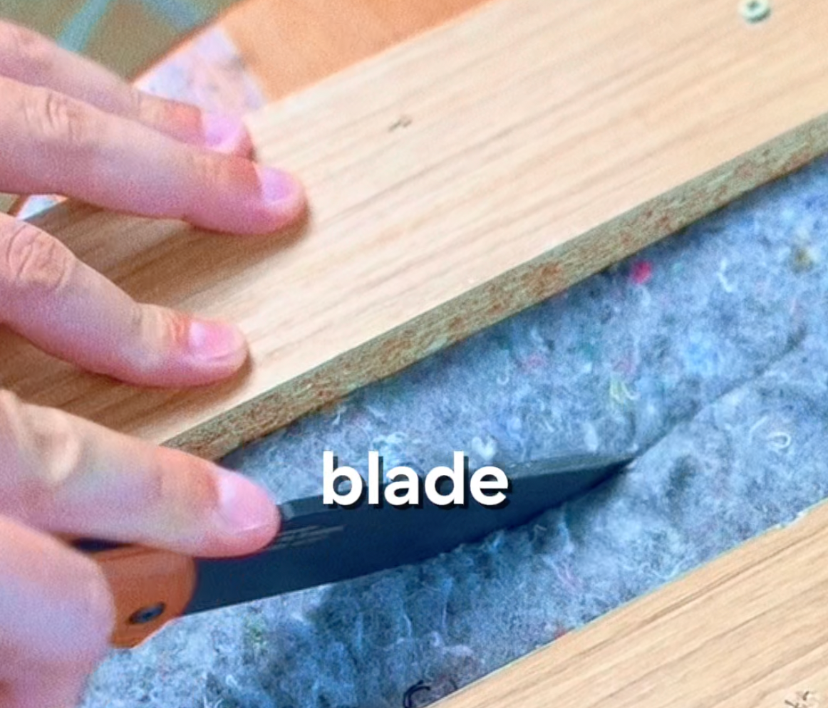 Automotive felt sample after knife test — puncture visible through two stacked layers, dense fiber compression around entry point, Test 10 of GAUSS Material Trials