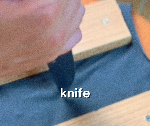 Cotton fabric sample after knife test — clean cut visible through two layers, Test 6 of GAUSS Material Trials