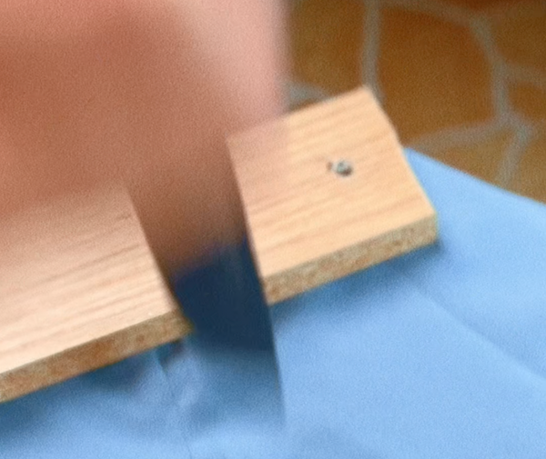 Nylon spandex sample after knife test — clean cut through two layers, no fraying, Test 8 of GAUSS Material Trials