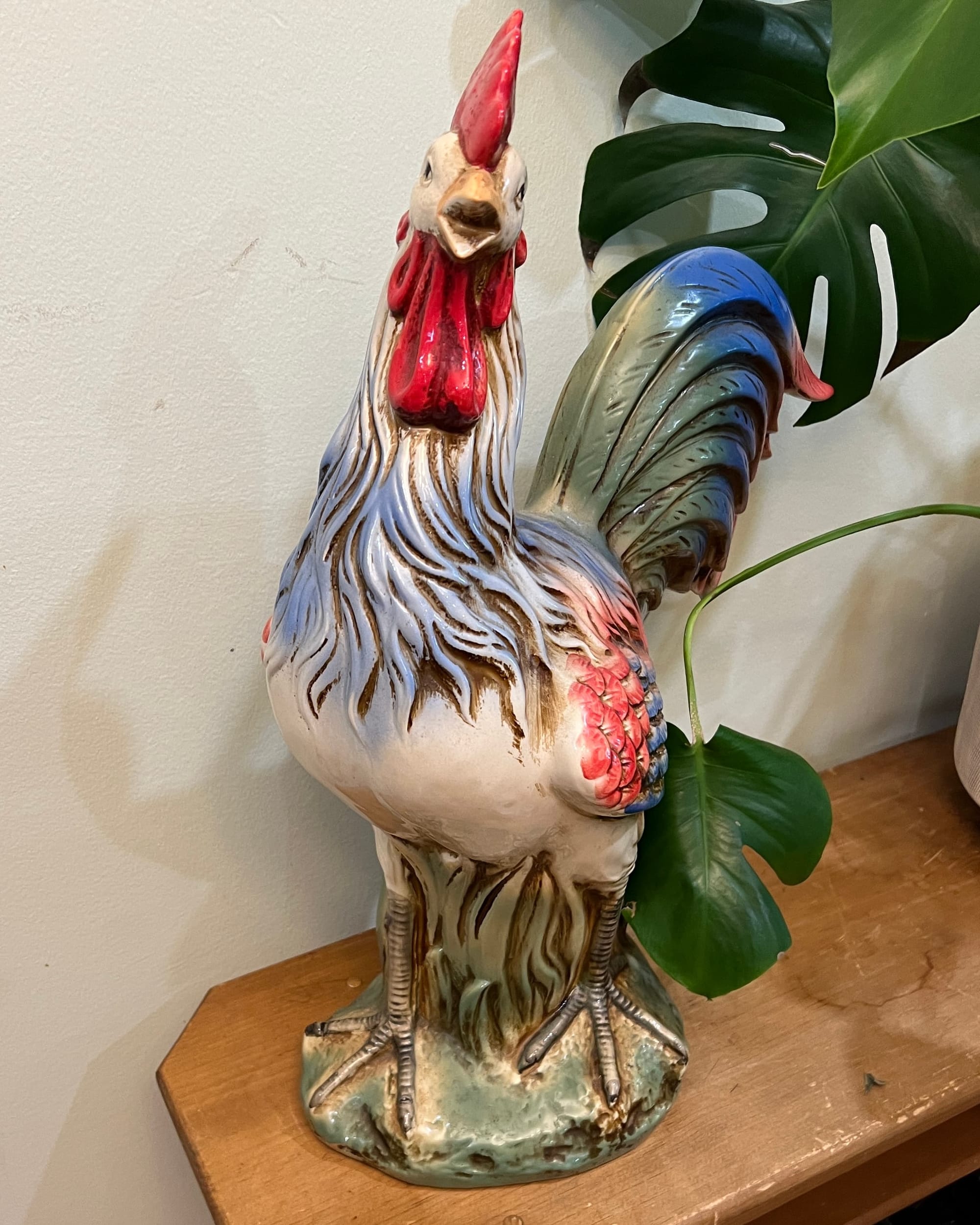 a 2 ft tall ugly ceramic rooster