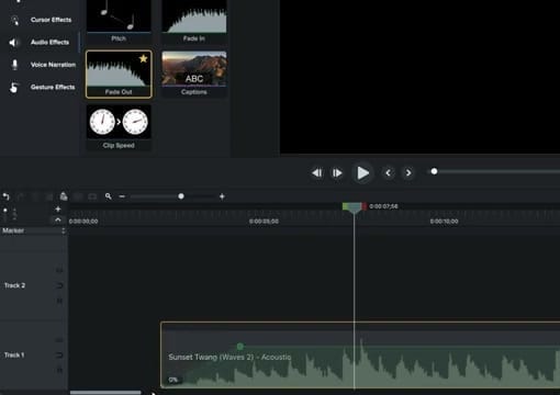 Camtasia timeline showing audio keyframe at 0% on the volume line of an audio clip with Fade Out applied