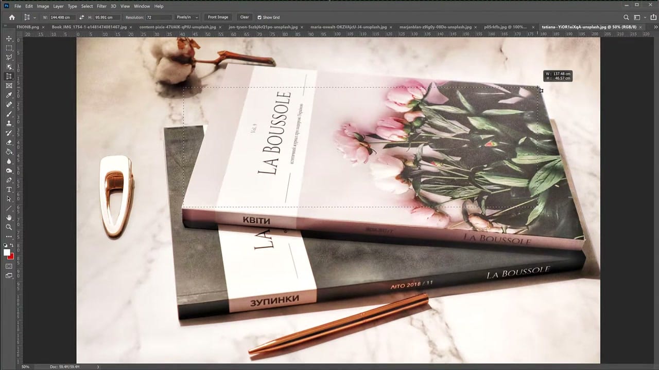 Perspective crop selection being drawn around a tilted magazine in Photoshop