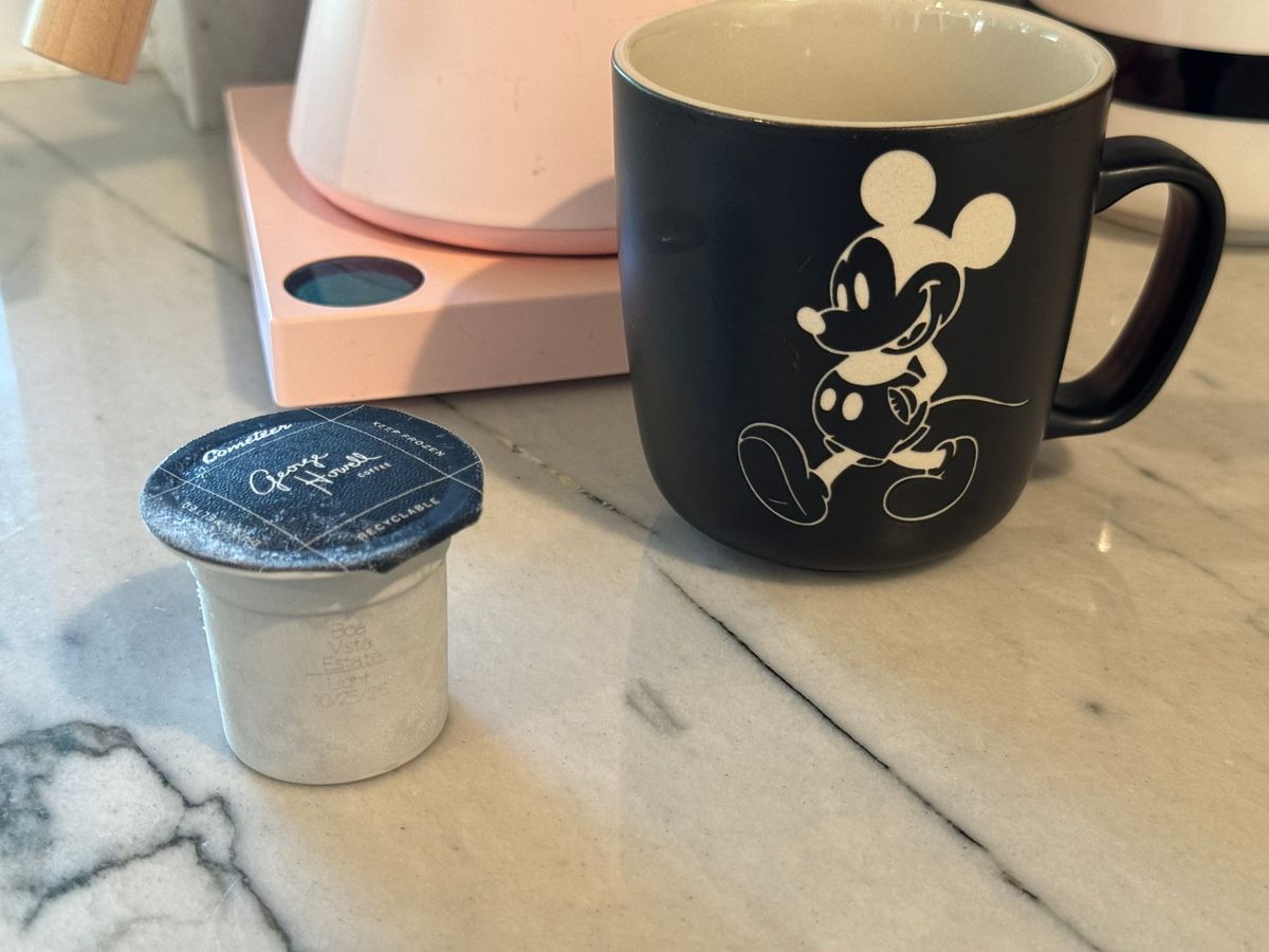 Cometeer pod, coffee cup and kettle