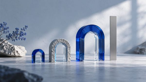 Miniature blue and stone portals beside a tall white block — SeeIndie