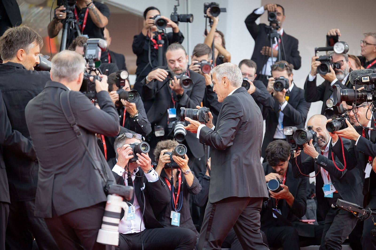 George Clooney and the photographers on the Venice red carpet.