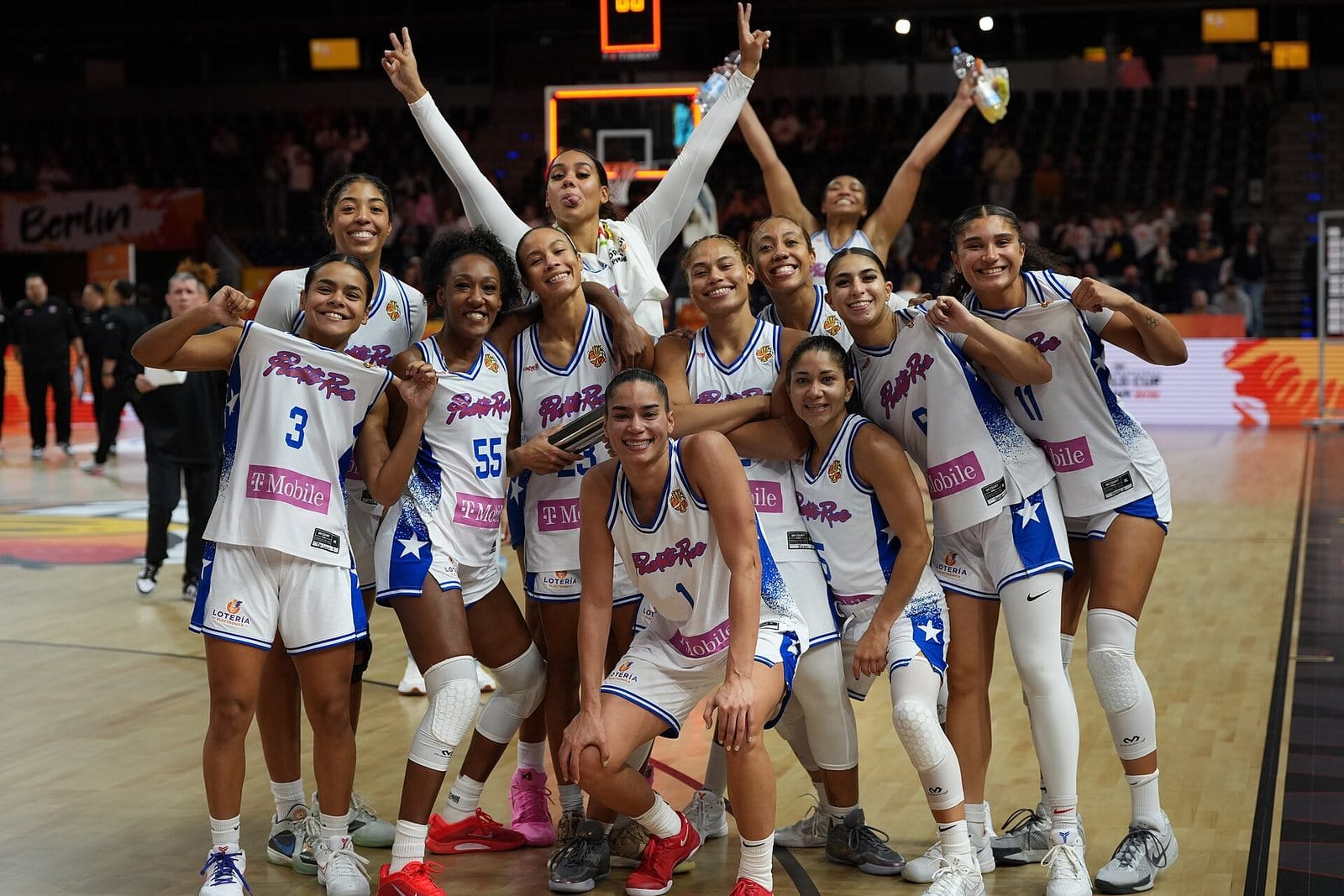 Puerto Rico's players celebrate together on court, arms raised