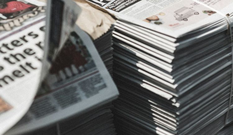 Piles of UK newspapers waiting for delivery