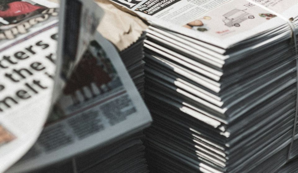 Piles of UK newspapers waiting for delivery