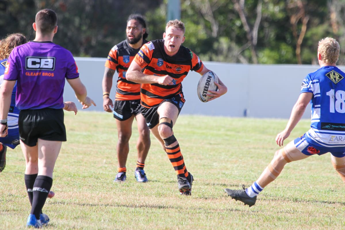 Bailey Gill tries to cut through Thirroul's defence. Photo: Helensburgh Tigers