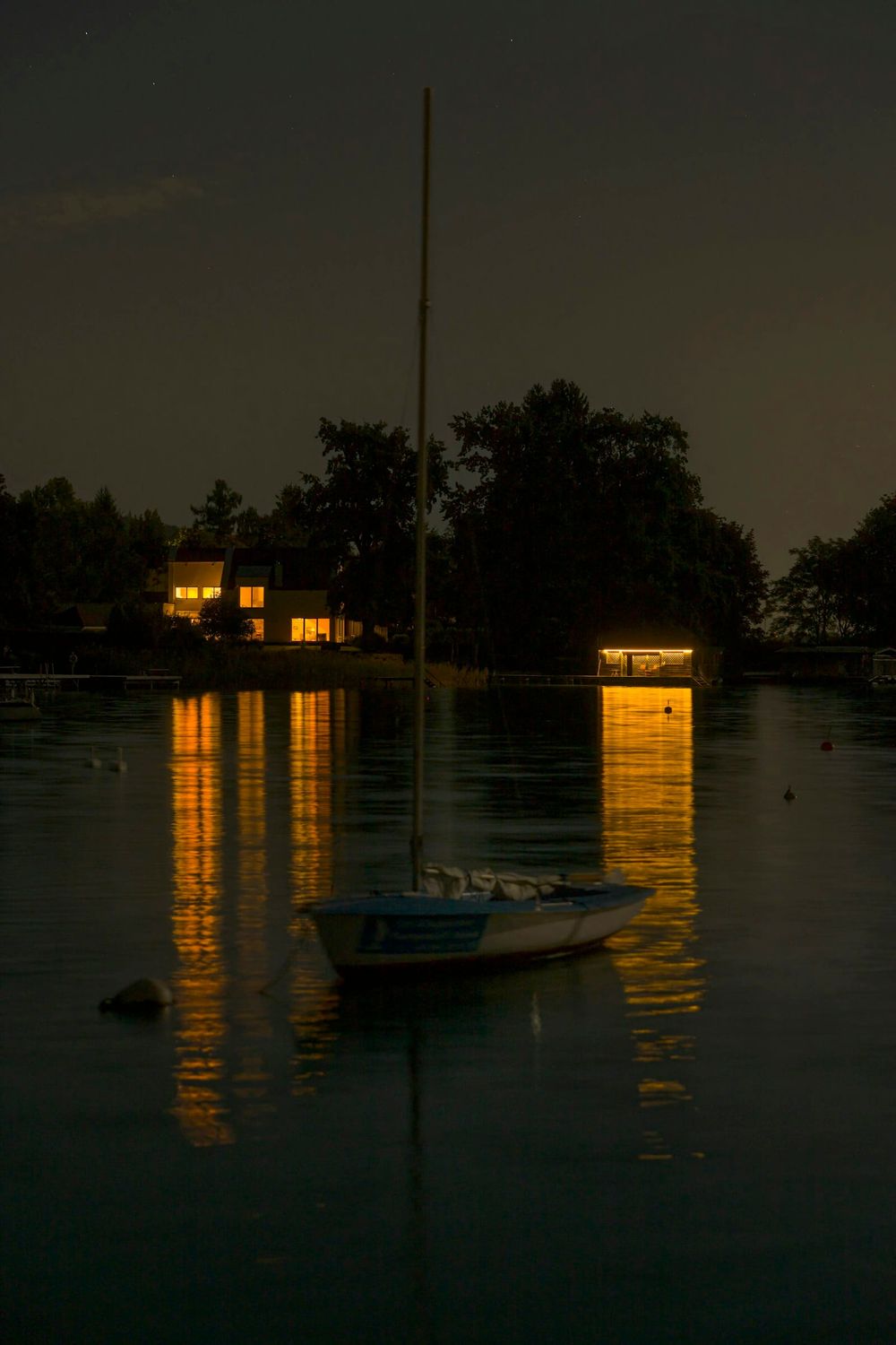Sailboat at anchor in a calm sheltered bay