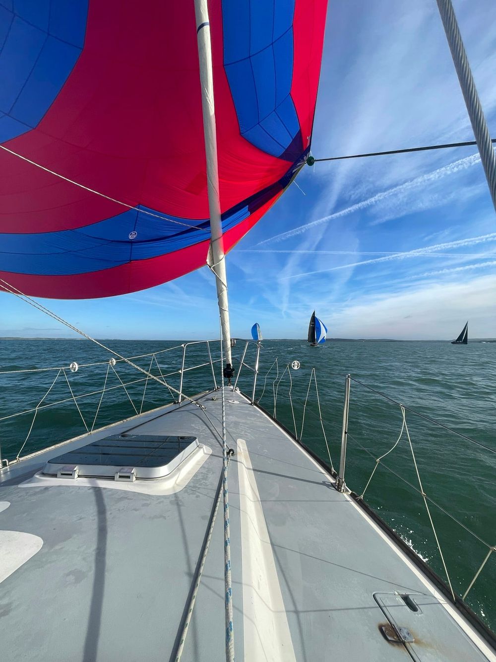 Spinnaker flying from sailboat bow