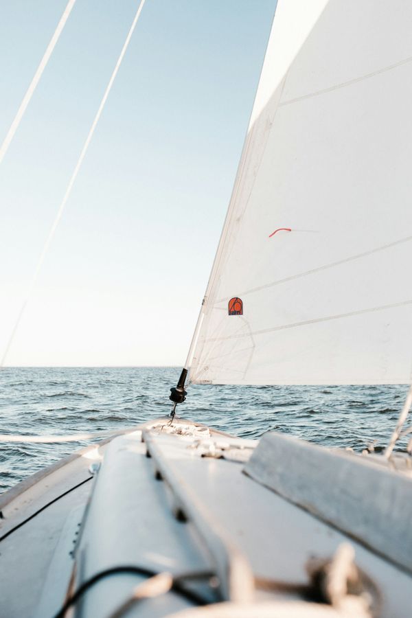 A sailing yacht heeled on a long offshore passage in open ocean