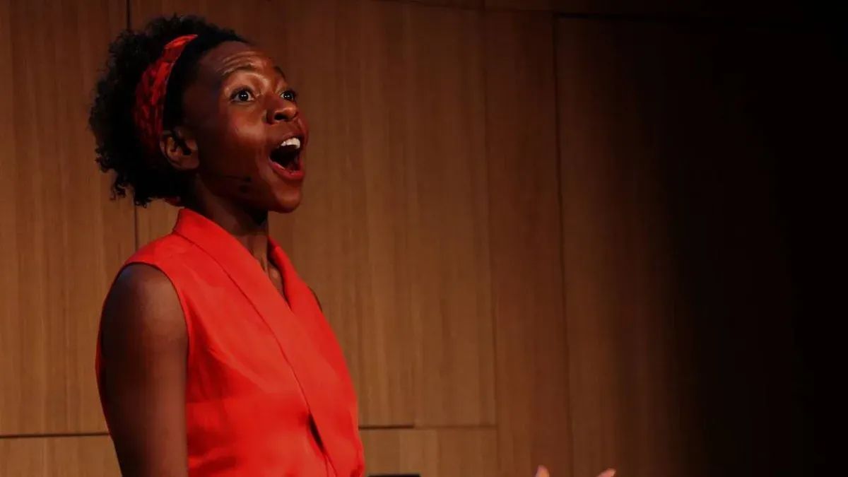 Professional speaker presenting to engaged audience onstage - The Inspiration Space