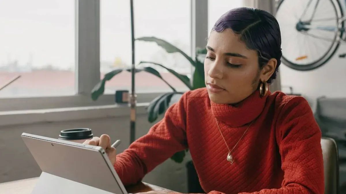 Focused entrepreneur working on high-priority business tasks - The Inspiration Space