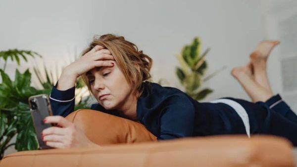 Stressed founder at desk during venture capital negotiation - The Inspiration Space