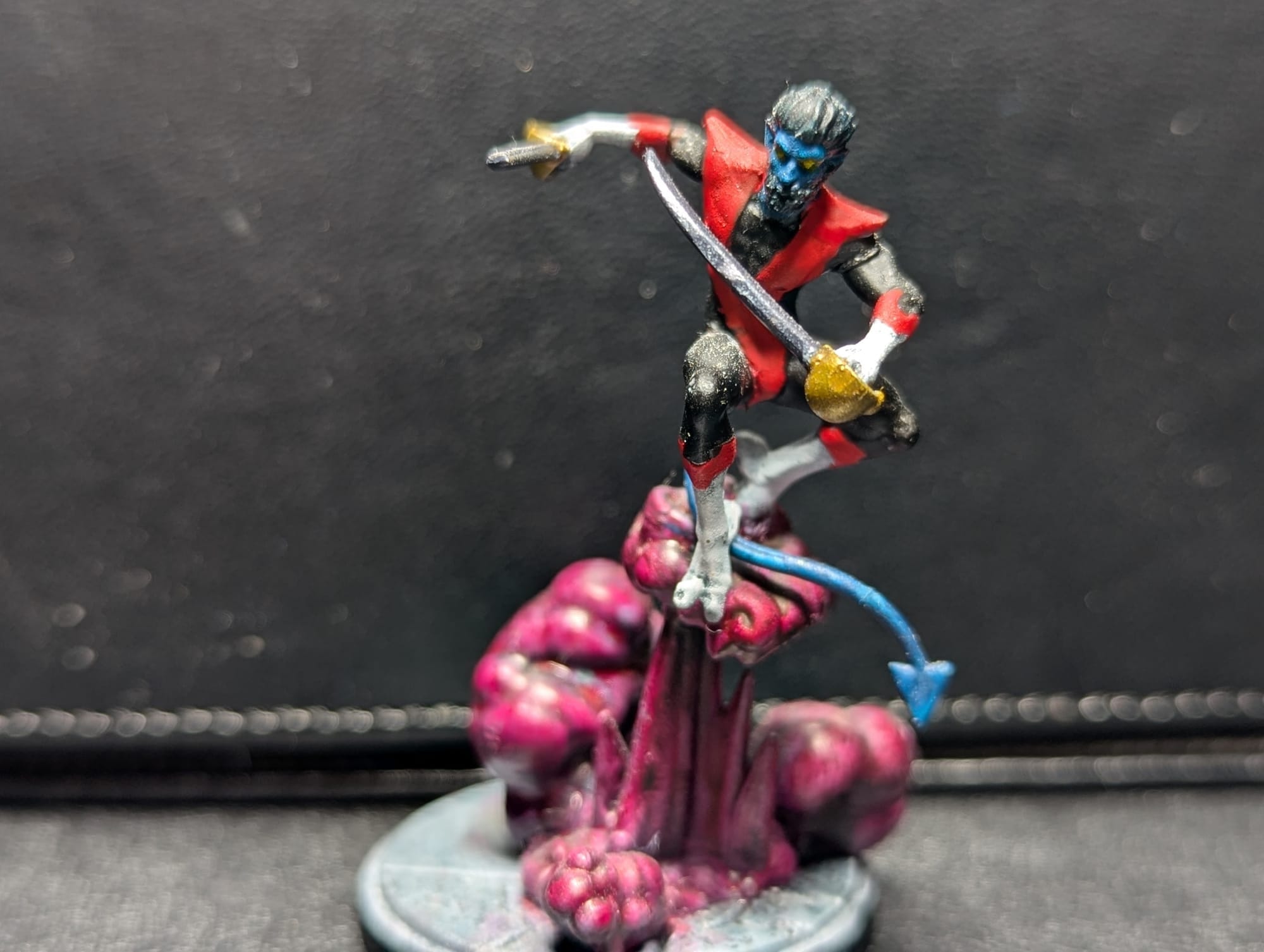 A painted Nightcrawler miniature from the game Marvel: Crisis Protocol