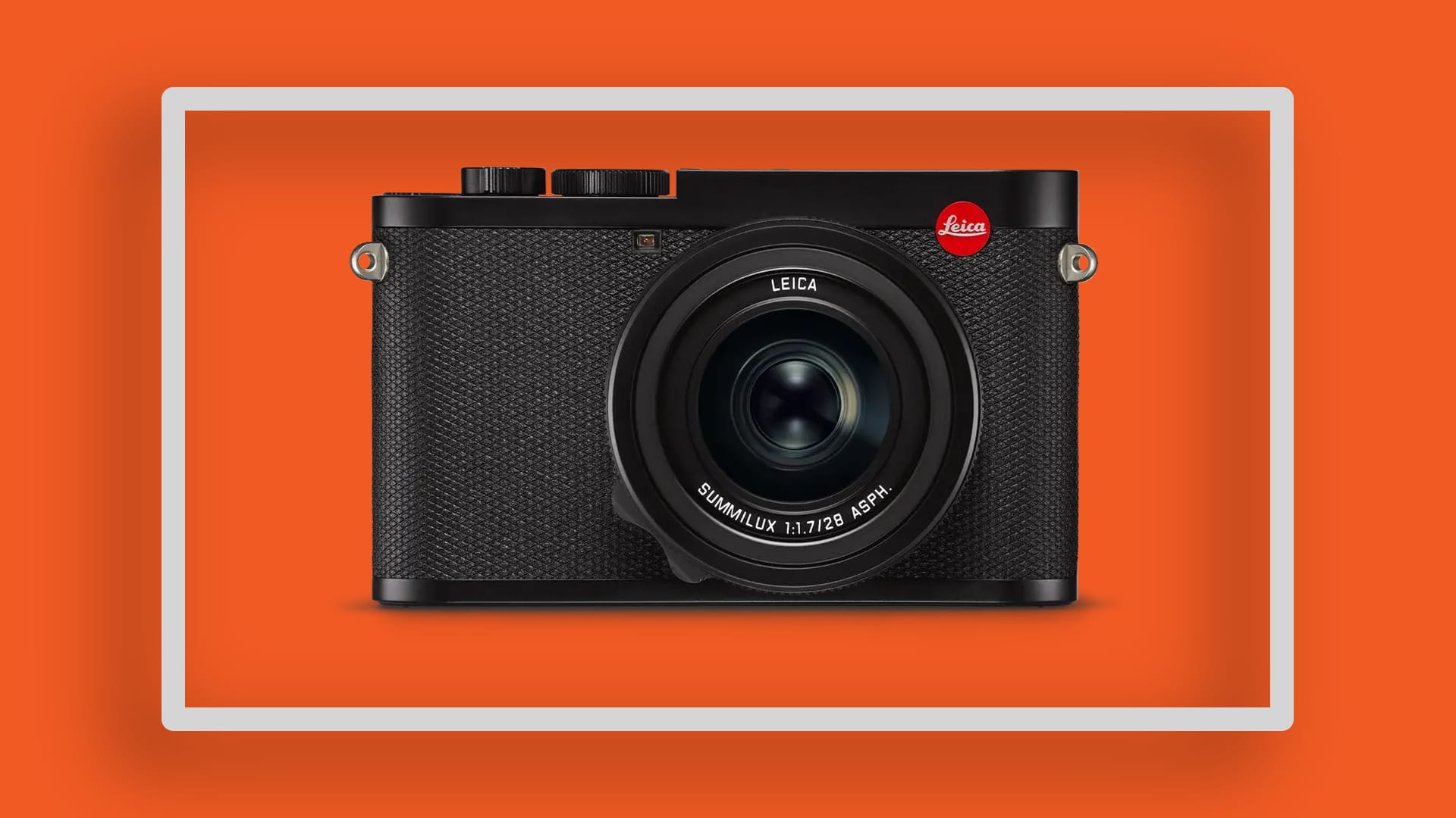 The Leica Q2on an orange background.