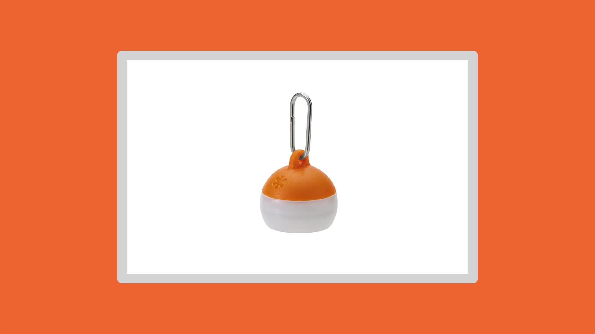 Tiny orange mini lantern on a white background.