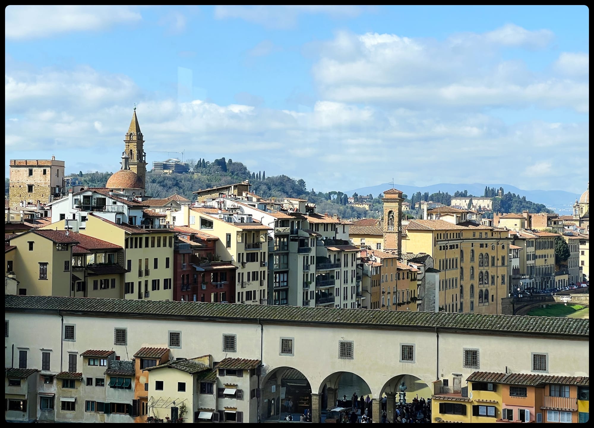 The Oltrarno neighborhood with the Ponte Vecchio bridge in the foreground.