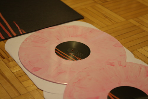 Marbled pink vinyl disc from City and Colour's 'Bring Me Your Love' with red center label details.