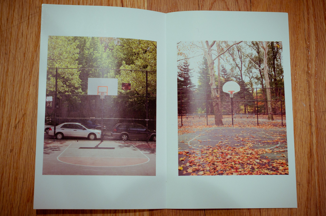 Open spread of a photography zine displaying contrasting summer and autumn photos of outdoor basketball courts, captured with a Fujifilm FinePix X100.