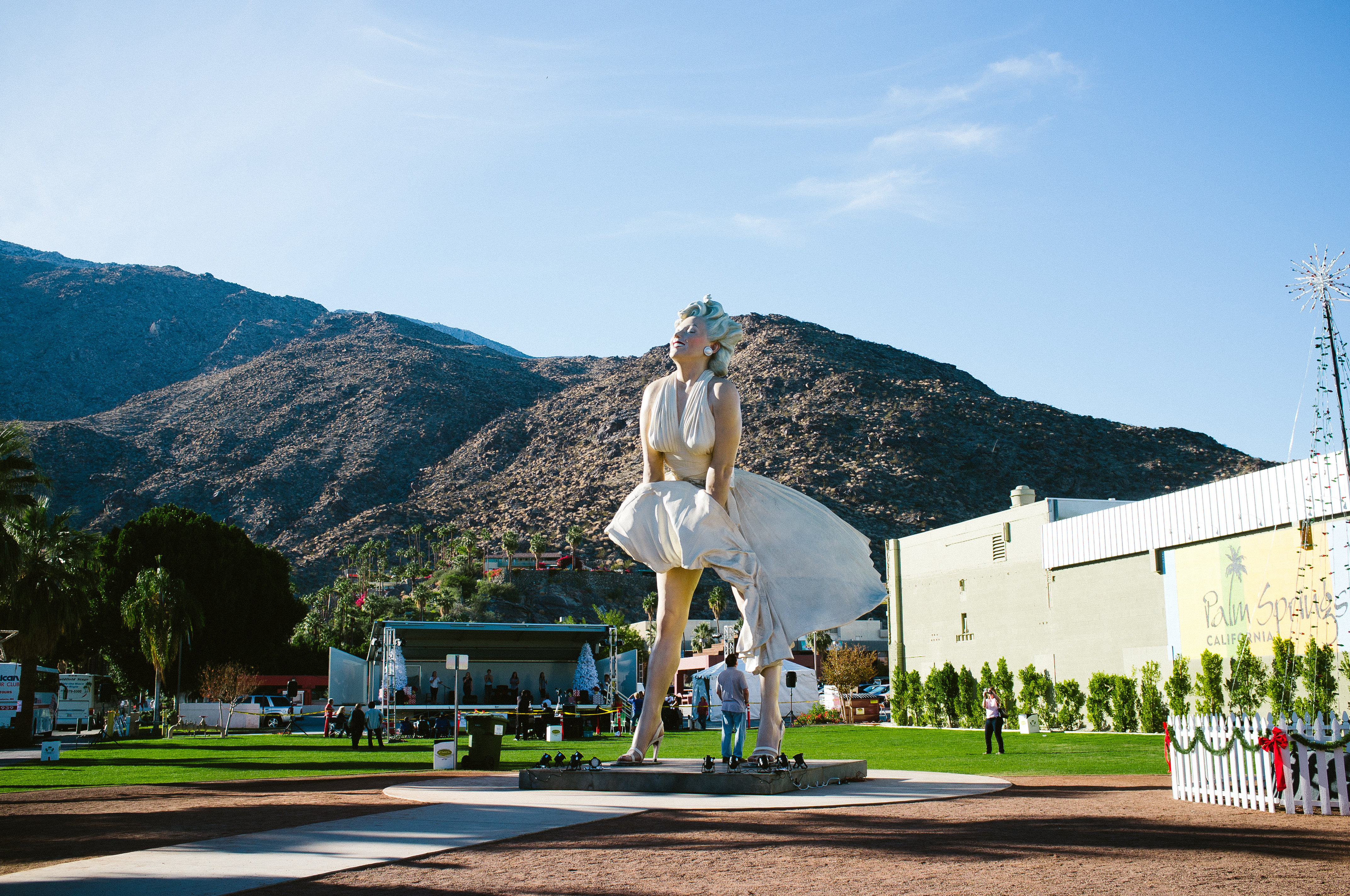 Colossal 'Forever Marilyn' Monroe statue depicted with billowing white dress against Palm Springs desert mountains.