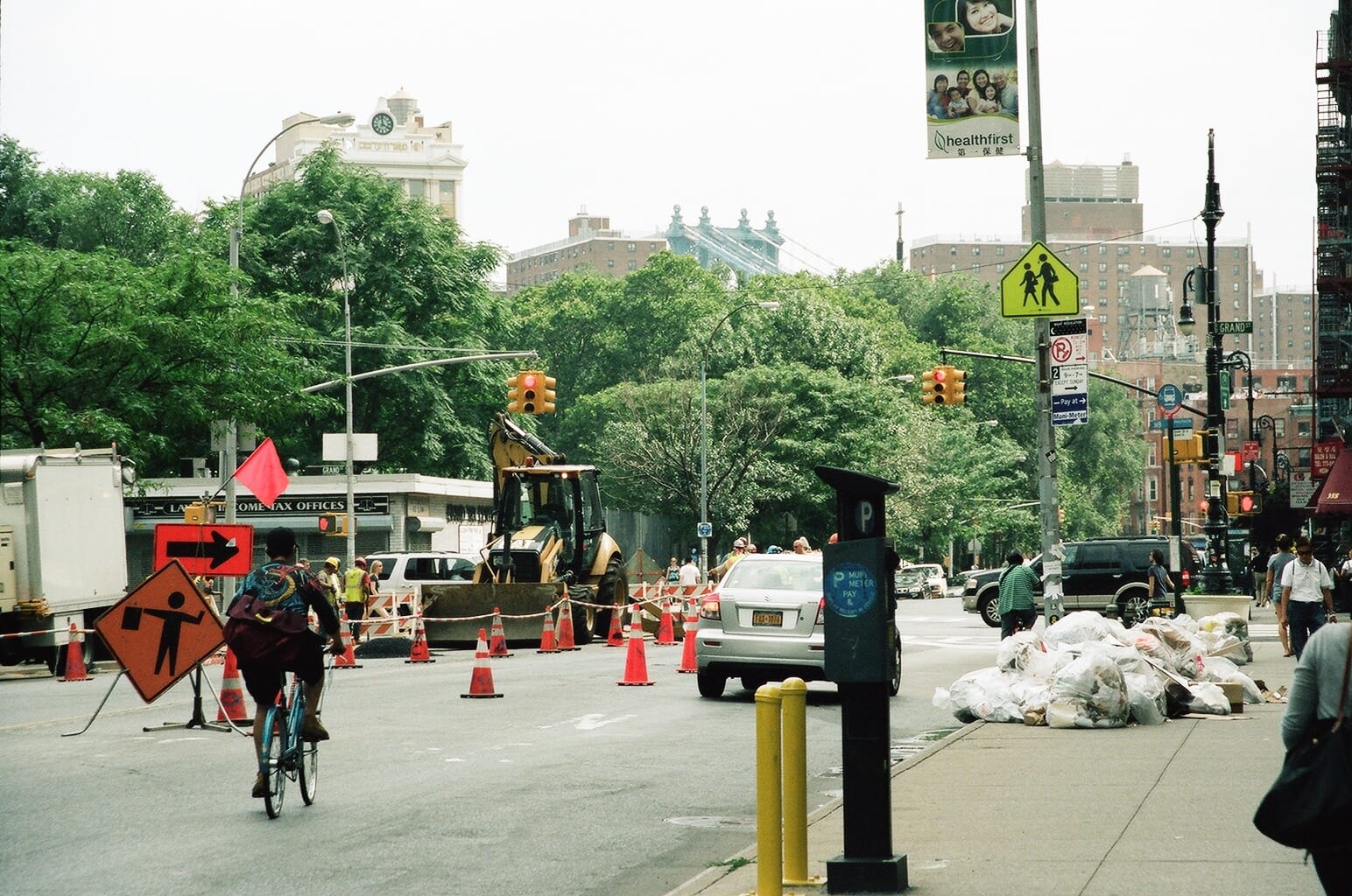 Street snapshot of urban transit and neighborhood scenes in New York City.
