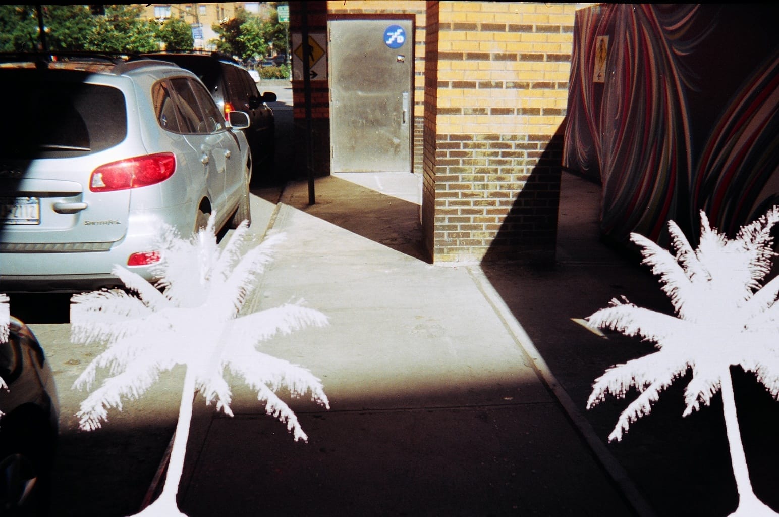 Street scene with graphic symbol overlay.
