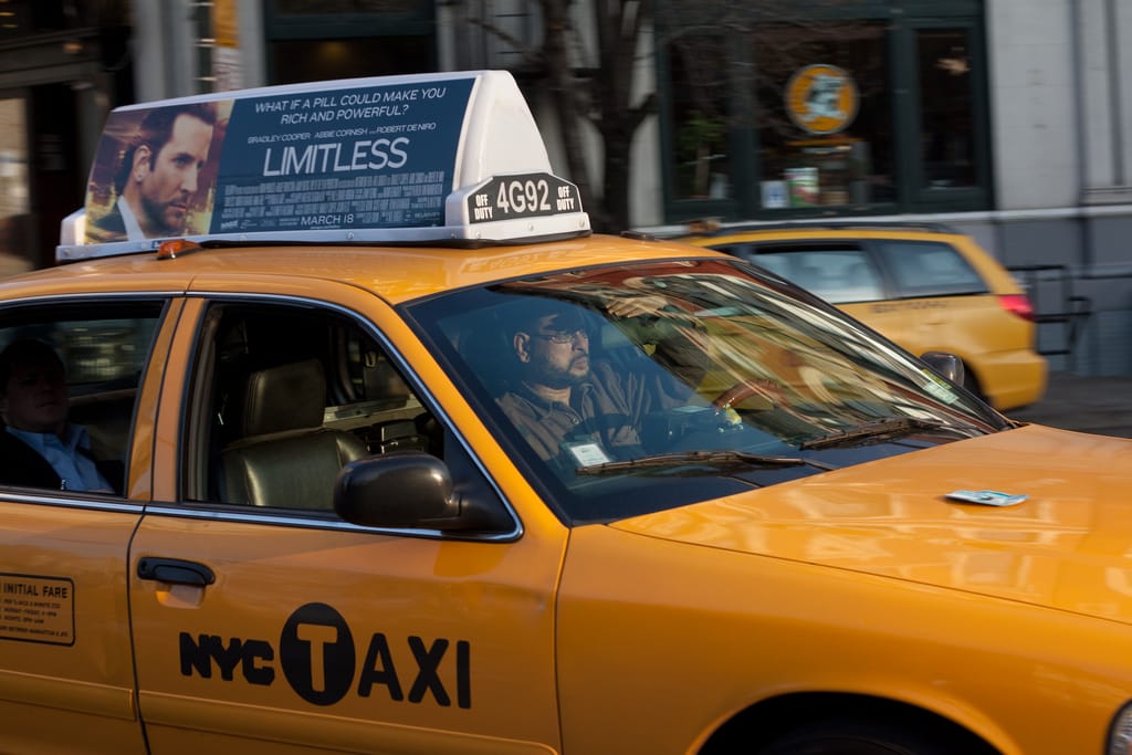 Photo of the Day - Cabbie Shielding From The Sun