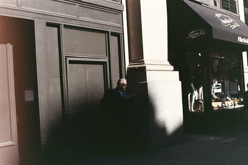 Photo of the Day - Man In Shadows Pentax ME Super | Lomography Color 800 One of the photos from the first roll of film through my new-ish Pentax ME Super camera. I used pretty cheap Lomography film to test and make sure the camera worked properly. Not crazy about the film (a bit too grainy, as you’ll be able to see in some of the other photos I’ll post in the coming weeks), but I got some usable pictures.