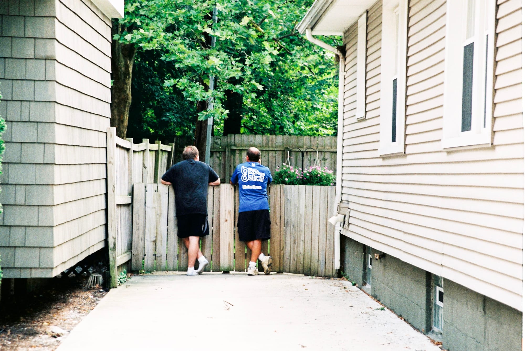 Candid streetscape photograph of a quiet residential neighborhood in Detroit, Michigan.
