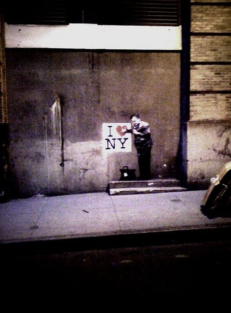 Detail perspective of Banksy street artwork in New York City.