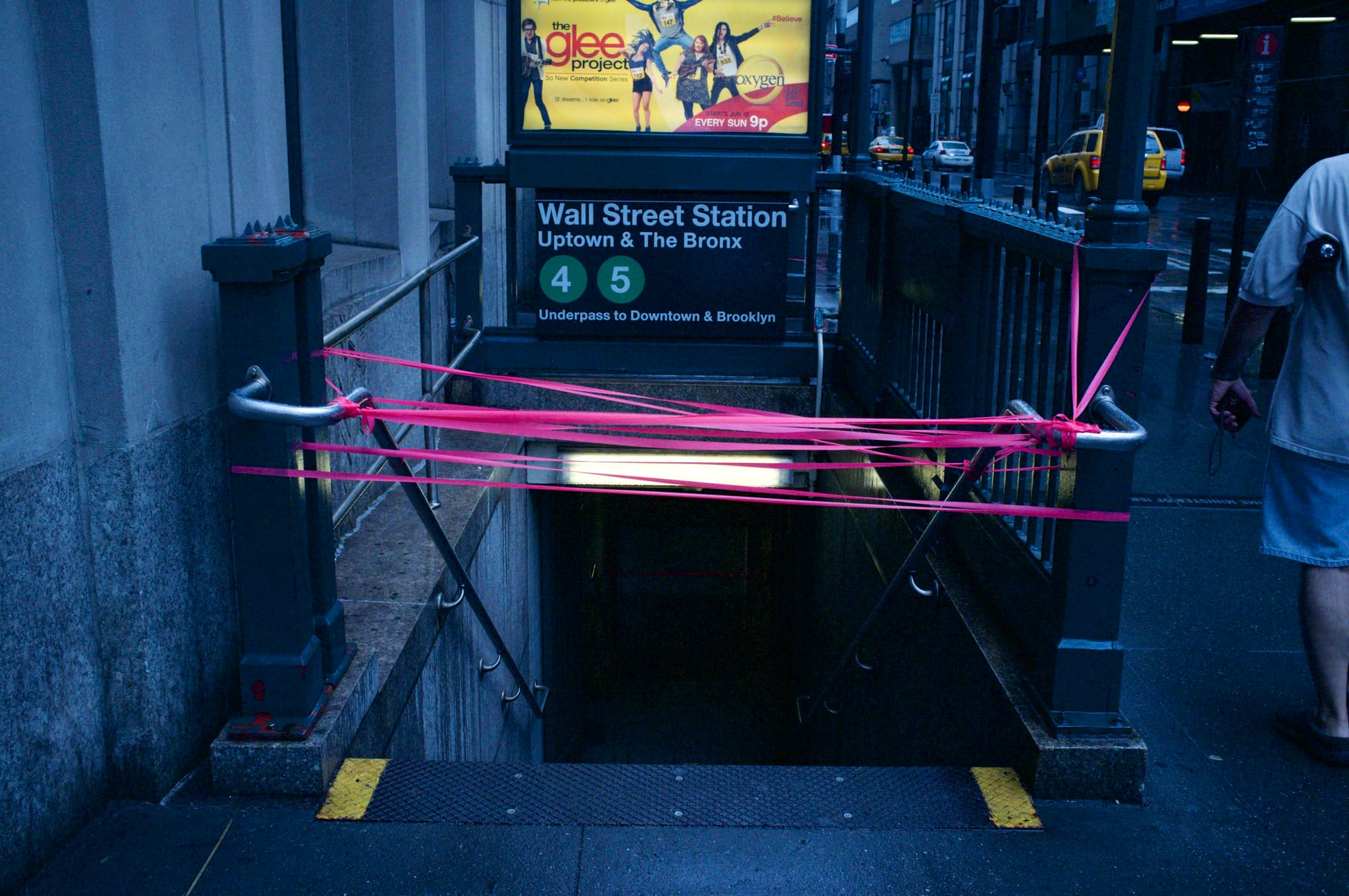 Wall Street subway station entrances taped off during mandatory transit shutdown for Hurricane Irene.