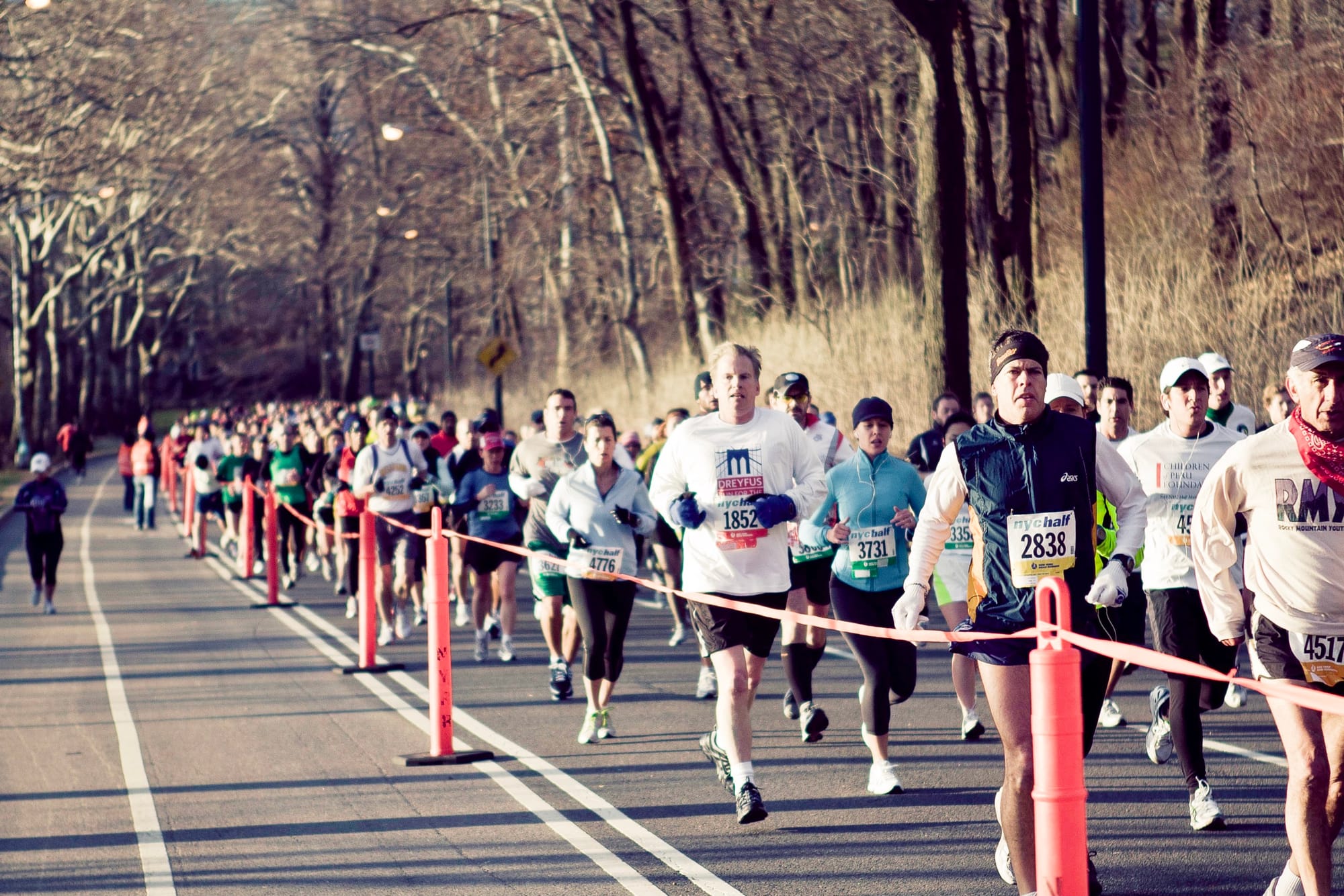 Runners streaming along the city streets during the New York City Half Marathon.