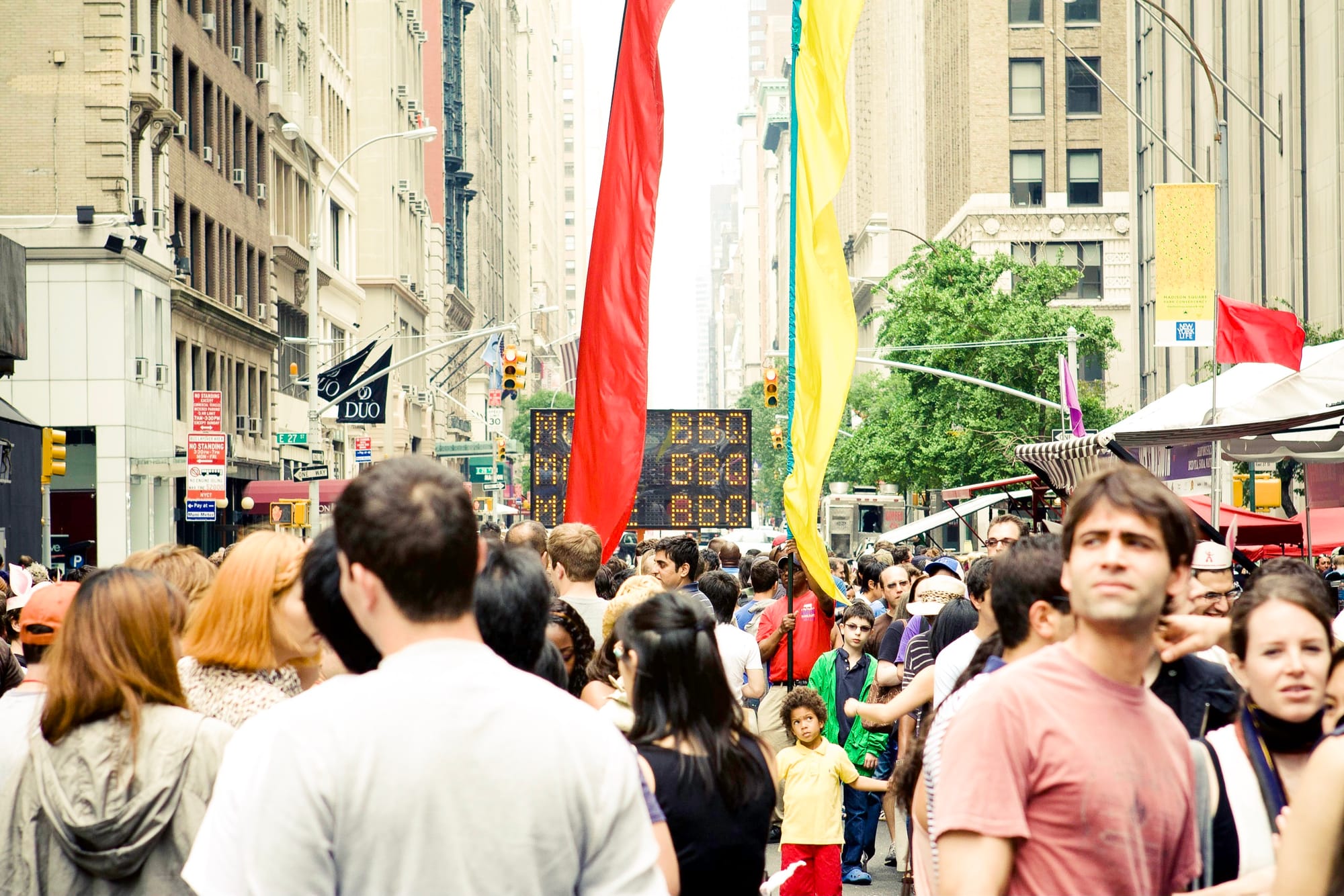 Crowds lining up for authentic regional barbecue specialties at the outdoor Big Apple BBQ festival in NYC.