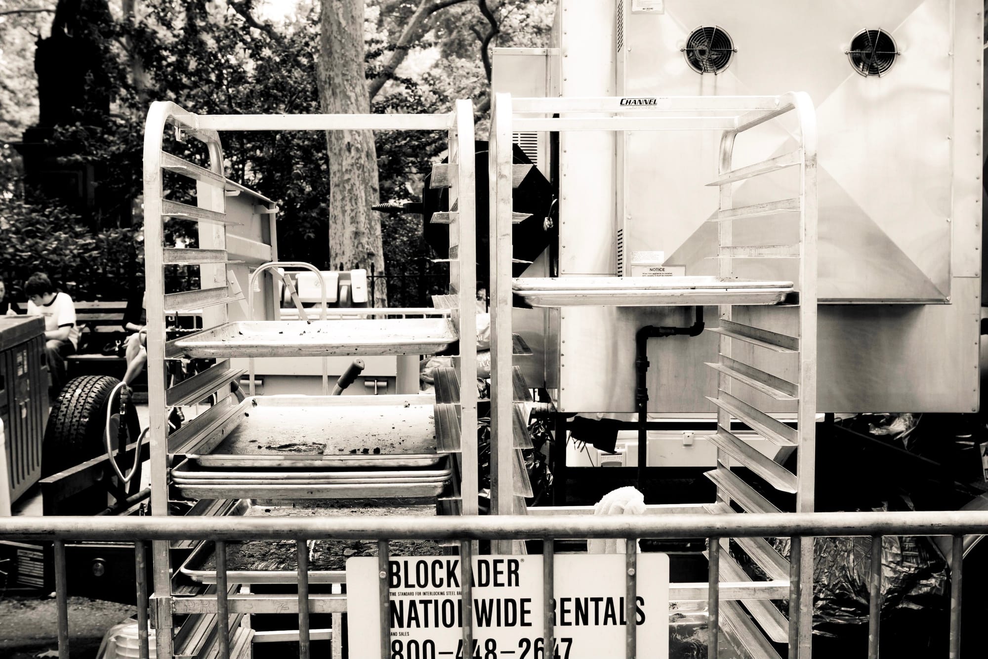 Barbecue pitmasters smoking meats over large outdoor pits at Big Apple BBQ in Madison Square Park.