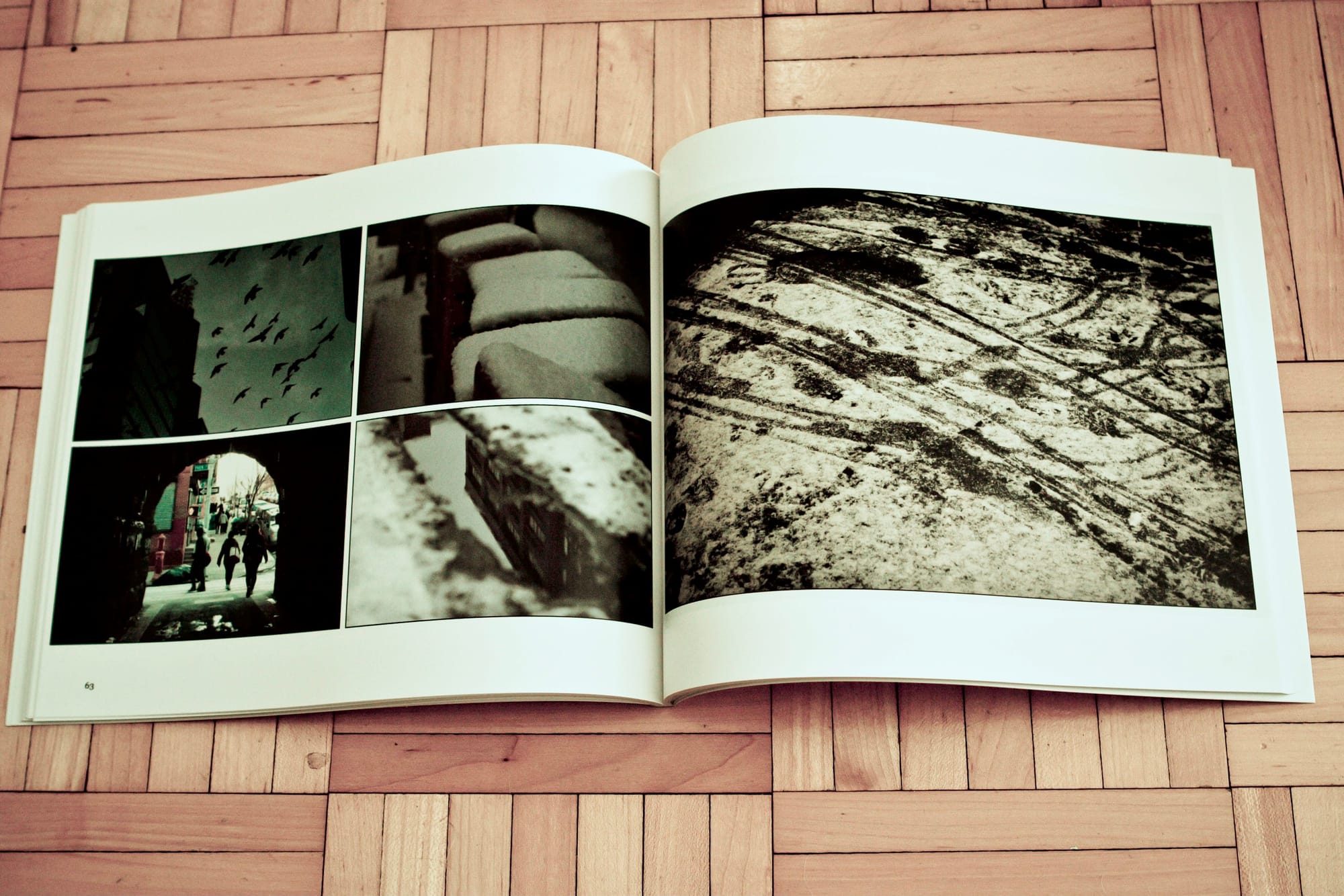 Stack of 15 printed copies of the 365 Project book from Blurb Books arranged on a flat surface.