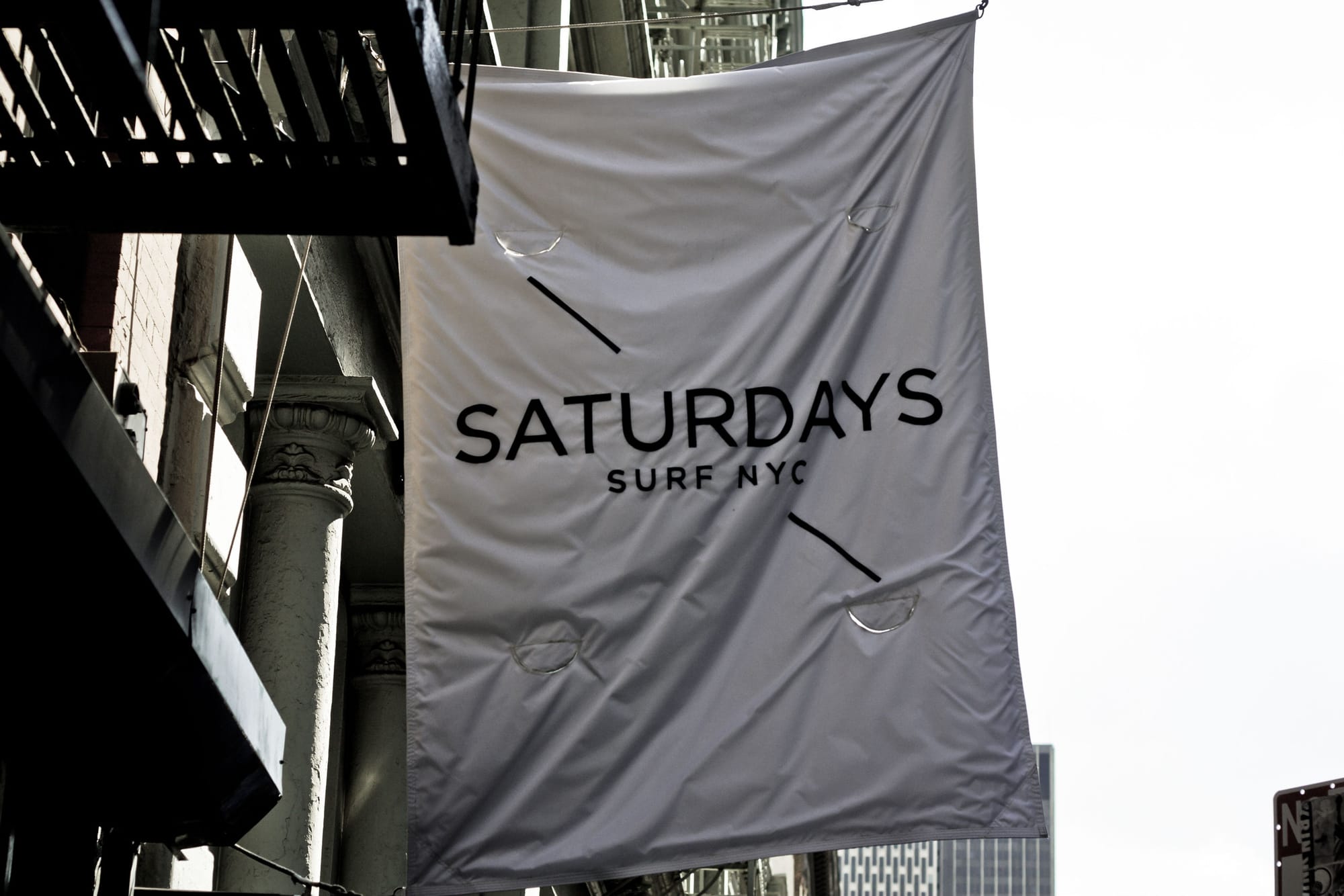 Saturdays Surf NYC boutique banner hanging outside the shop in SoHo.