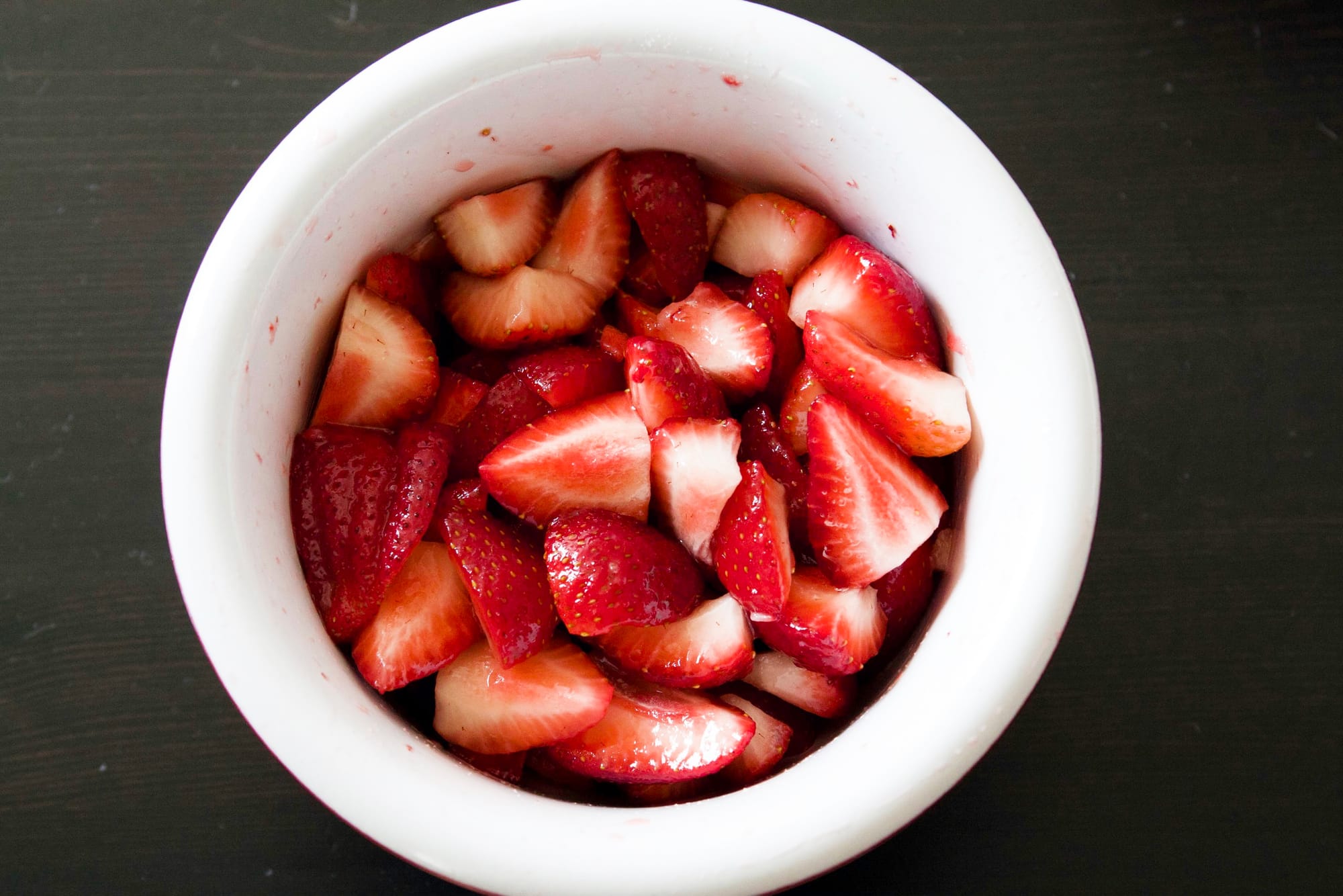 Fourth of July strawberry shortcake dessert garnished with strawberries and whipped cream.