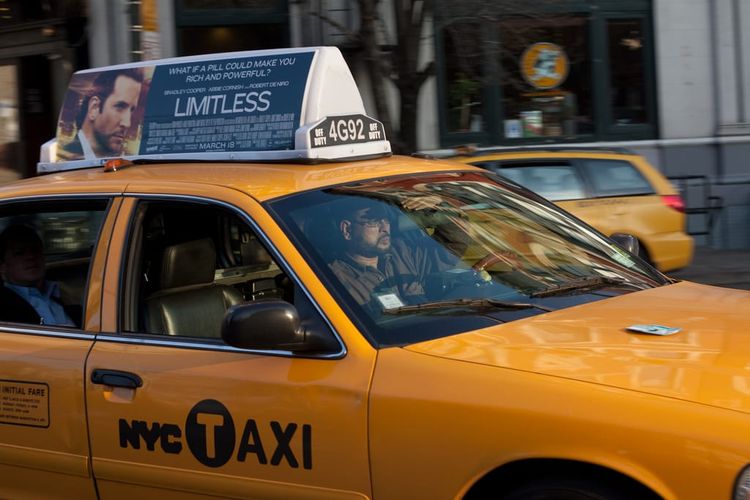 Photo of the Day - Cabbie Shielding From The Sun