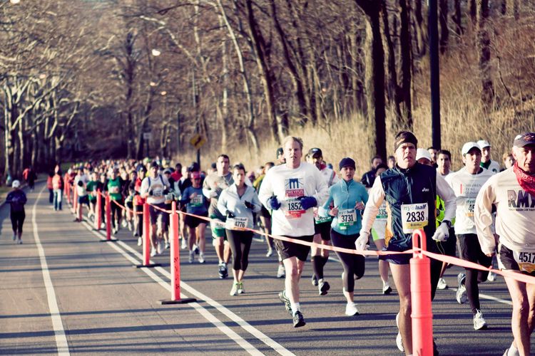 Runners streaming along the city streets during the New York City Half Marathon.