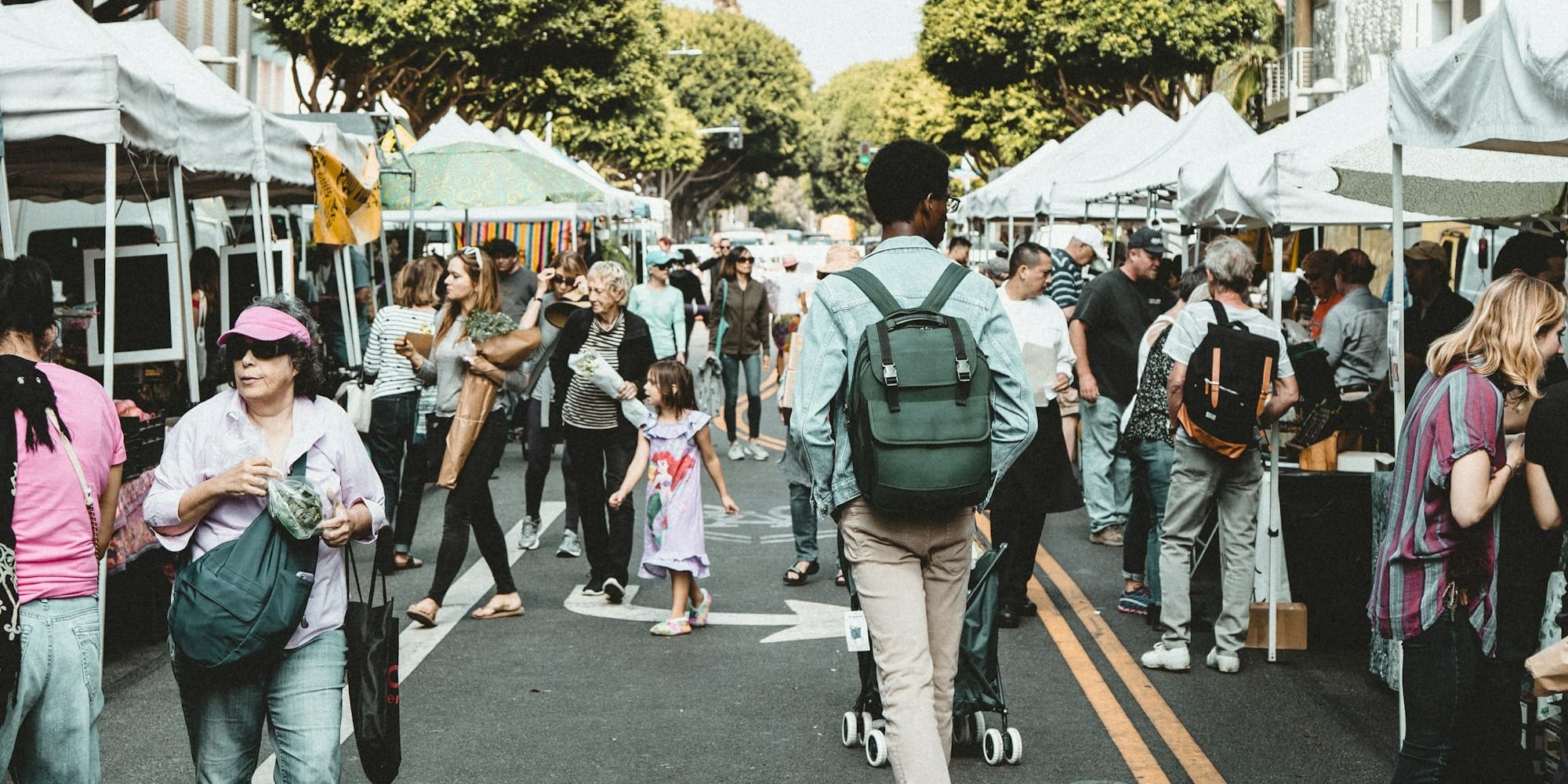 people walking on walkway during daytime