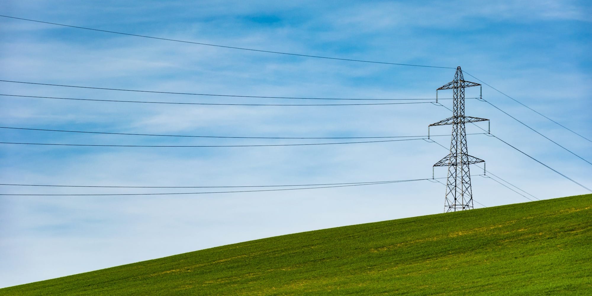 electrical tower on grass field