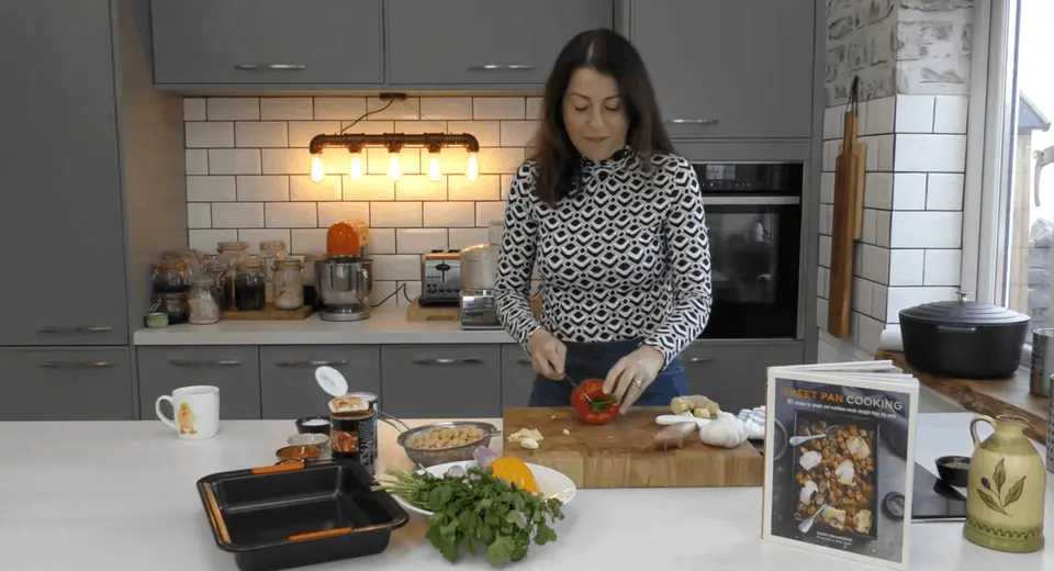 Jenny Tschieshe highlighting a sheet pan recipe for her book