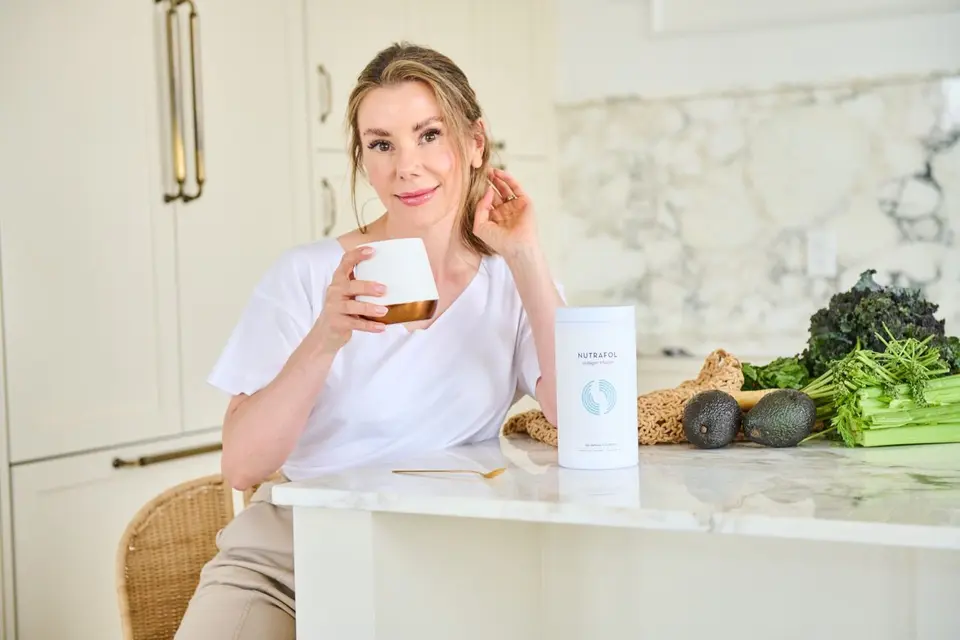 Jennifer Hanway, women's health and wellness expert, drinking nutrafol
